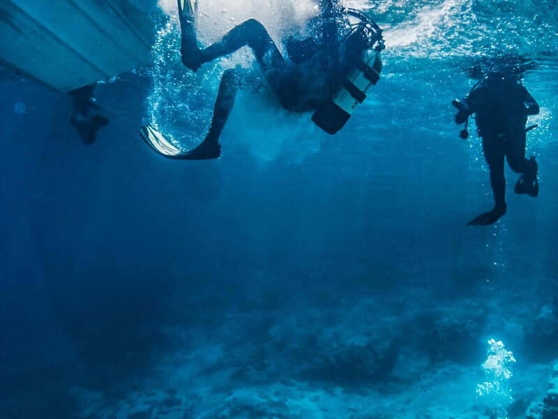 diver surfacing from underwater