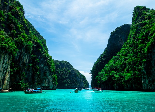 Boats swimming in the ocean in Phuket