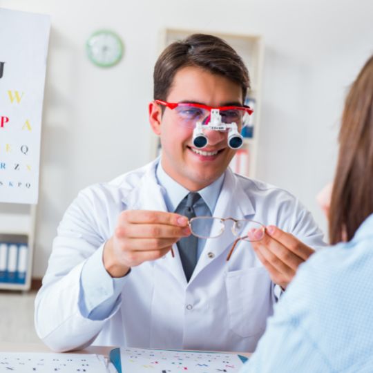 an ophthalmologist doctor with a patient